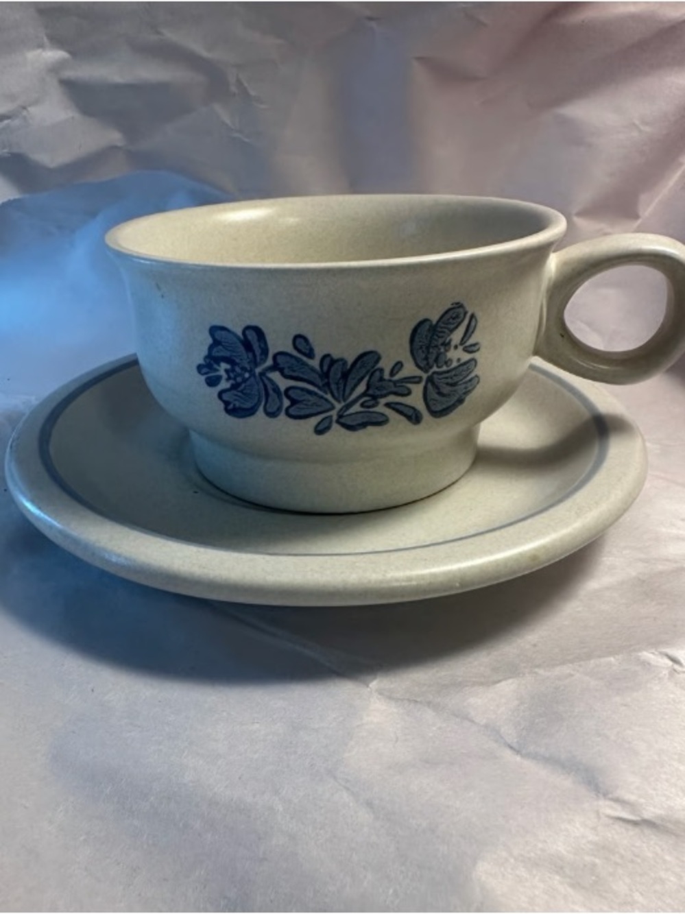 Cream Stoneware Mug and Saucer with Blue Floral Accent